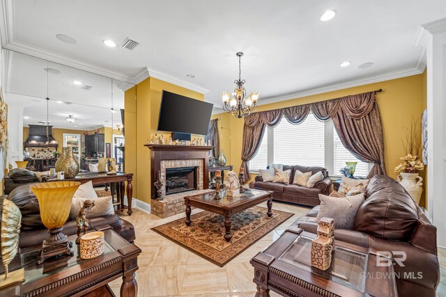 living room with crown molding, light parquet floors, a fireplace, and an inviting chandelier