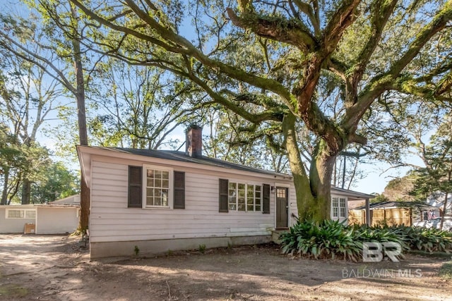 view of front of home with a chimney