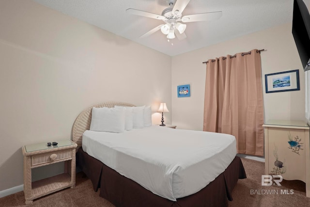 bedroom with carpet flooring, ceiling fan, and a textured ceiling