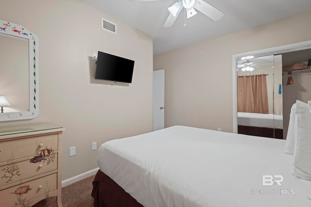 carpeted bedroom featuring ceiling fan and a closet