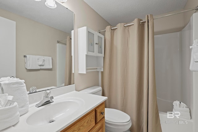 full bathroom with a textured ceiling, vanity, toilet, and shower / tub combo