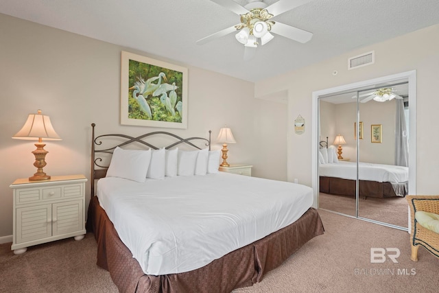 bedroom featuring carpet floors, ceiling fan, and a closet