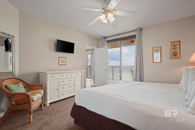 carpeted bedroom with a textured ceiling, access to exterior, and ceiling fan