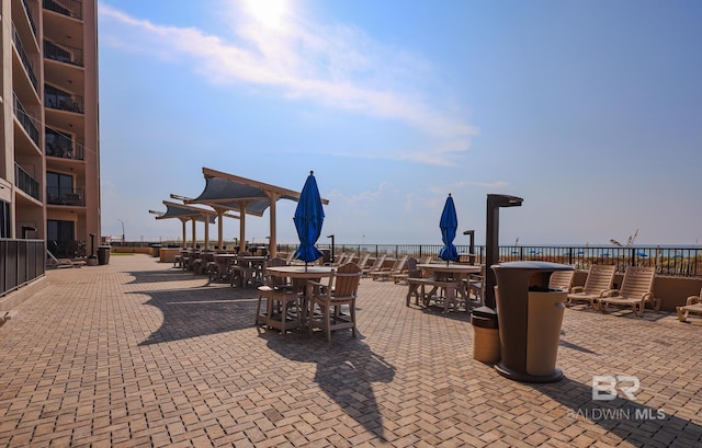 view of patio with a water view