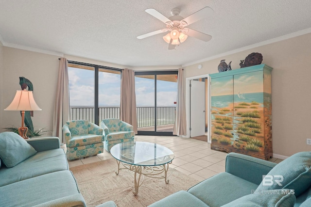 tiled living room featuring ornamental molding, a textured ceiling, and ceiling fan