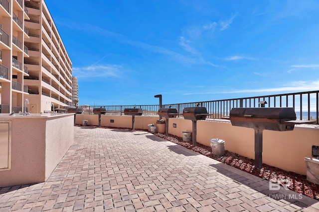 view of patio with a balcony and area for grilling