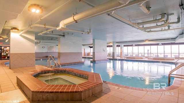 view of pool with sink and an indoor in ground hot tub