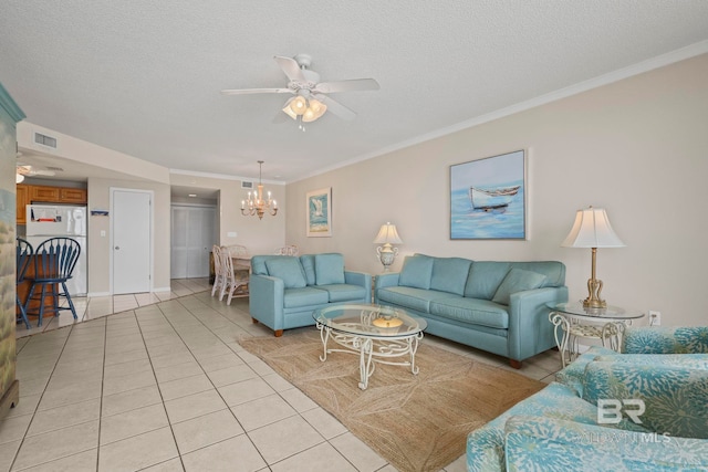 living room with a textured ceiling, crown molding, light tile patterned floors, and ceiling fan with notable chandelier