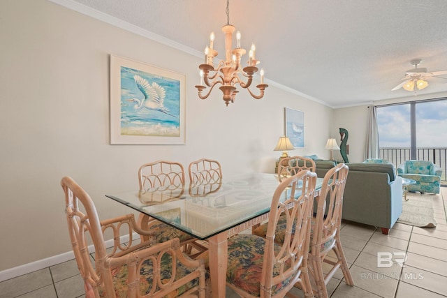 dining space with ceiling fan with notable chandelier, light tile patterned flooring, and ornamental molding