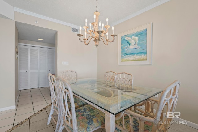 dining area featuring crown molding, an inviting chandelier, a textured ceiling, and light tile patterned floors