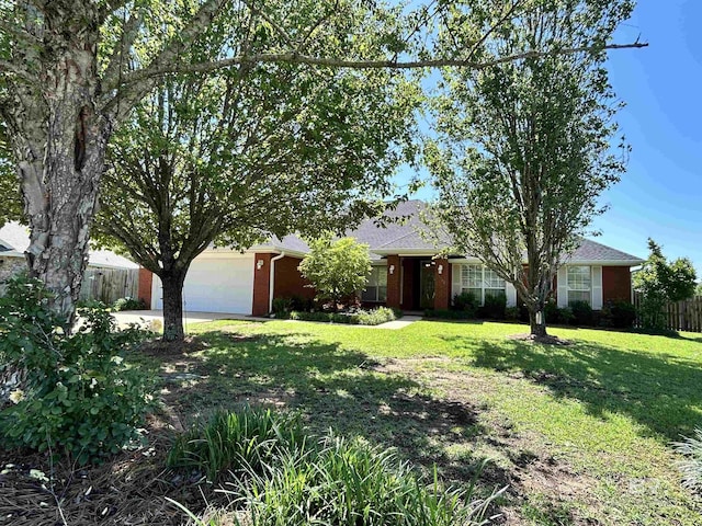 single story home featuring a garage, fence, a front lawn, brick siding, and concrete driveway