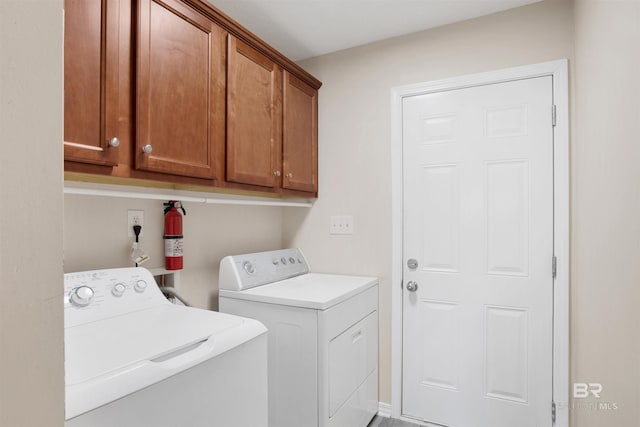 laundry room featuring cabinet space and independent washer and dryer