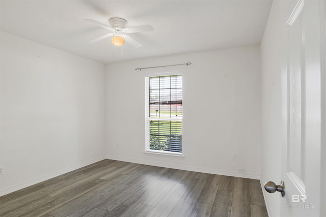 unfurnished room with baseboards, a ceiling fan, and wood finished floors
