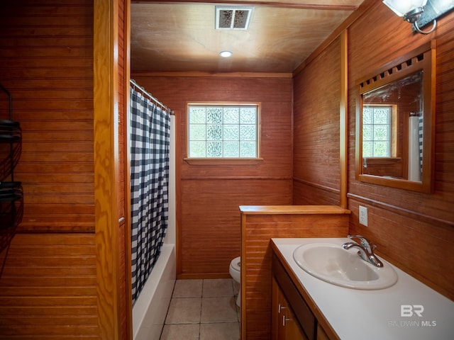 full bathroom featuring a wealth of natural light, visible vents, tile patterned floors, and toilet