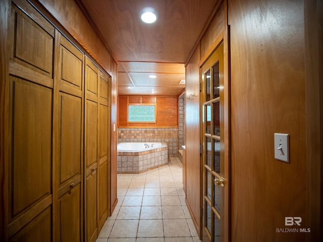 bathroom featuring tile patterned floors, wooden ceiling, a garden tub, and recessed lighting