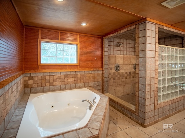 bathroom with a tile shower, recessed lighting, a tub with jets, tile patterned floors, and visible vents