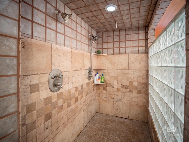 full bathroom with a tile shower