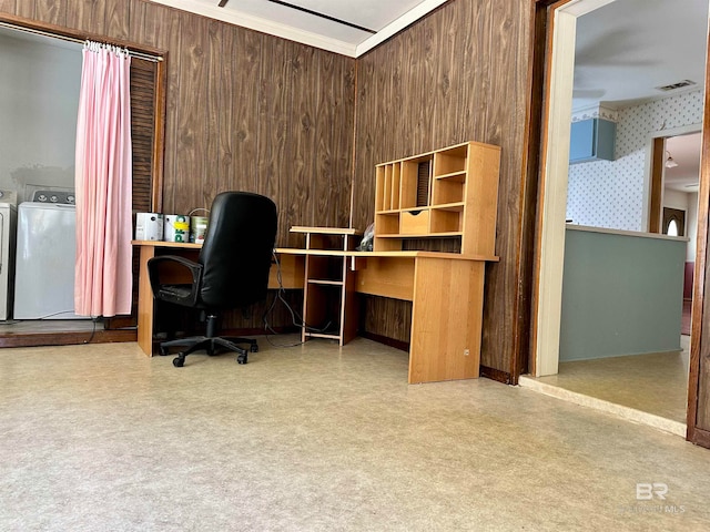 office space featuring wooden walls and washer and dryer