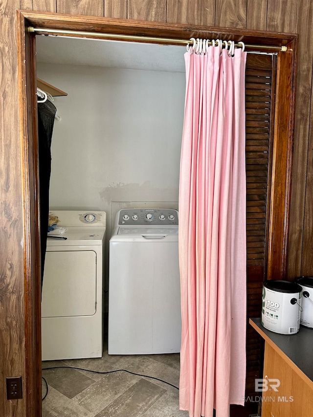 washroom with washing machine and clothes dryer