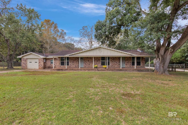 ranch-style house with a front lawn and a garage