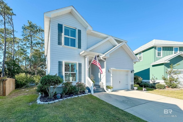 traditional-style home with driveway, a front lawn, an attached garage, and fence