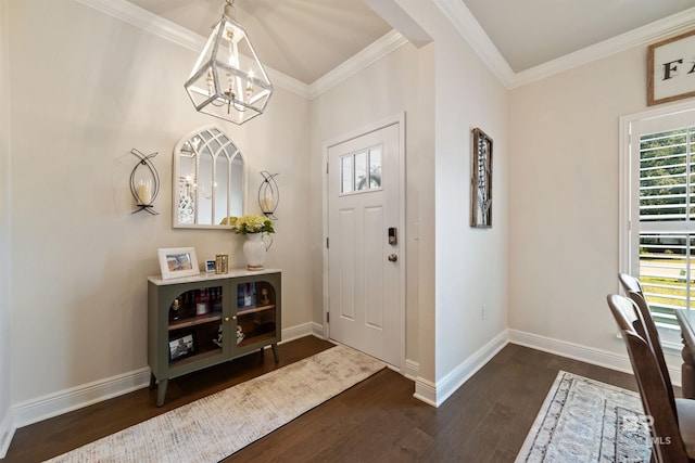 entryway with a chandelier, dark wood-style flooring, crown molding, and baseboards