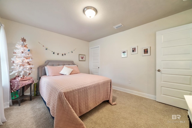 bedroom with light carpet, baseboards, and visible vents