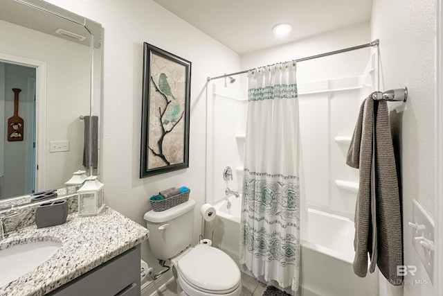 bathroom featuring toilet, shower / bath combo with shower curtain, and vanity