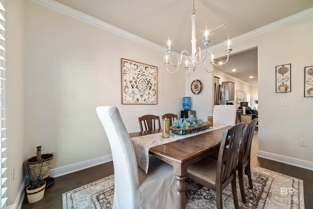 dining space featuring ornamental molding, a notable chandelier, dark wood finished floors, and baseboards