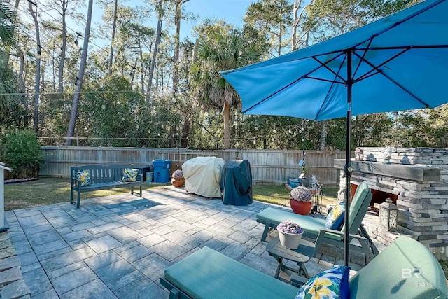 view of patio with a fenced backyard and grilling area