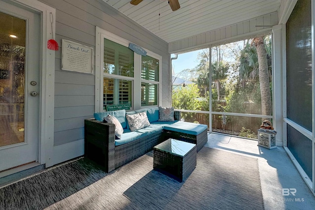 sunroom featuring ceiling fan