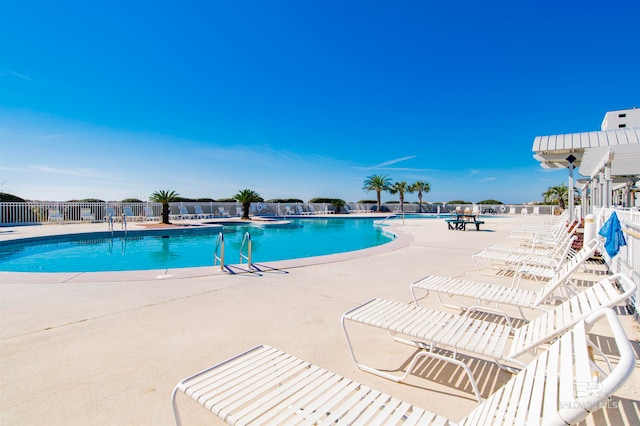 view of swimming pool with a patio area