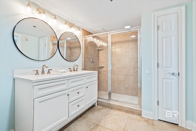 bathroom featuring vanity, tile patterned flooring, and a shower with door