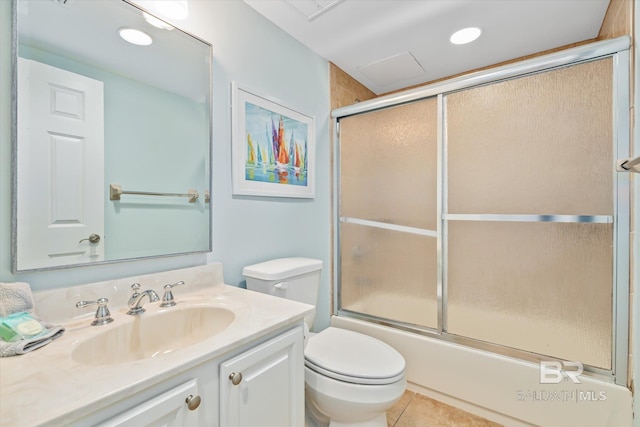 full bathroom featuring vanity, tile patterned flooring, shower / bath combination with glass door, and toilet