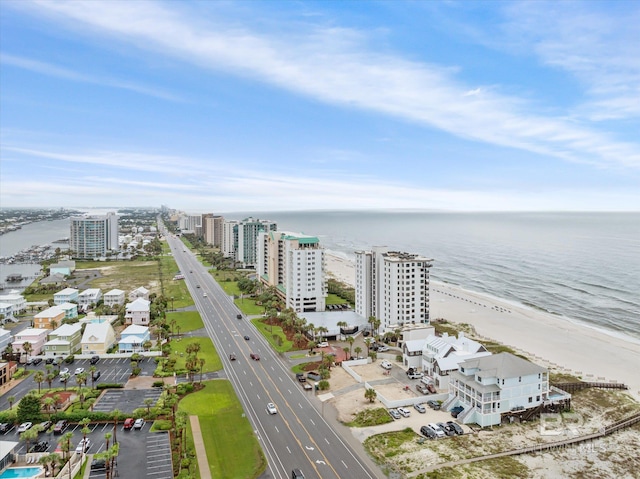 drone / aerial view featuring a view of the beach and a water view