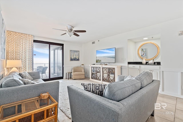 tiled living room with sink and ceiling fan