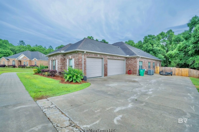 view of side of home with a garage and a yard