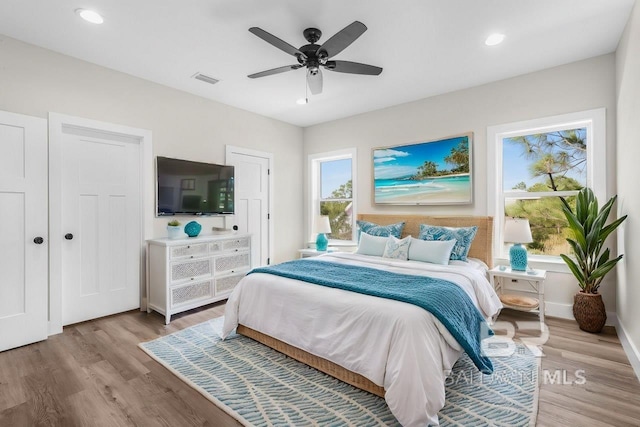 bedroom featuring ceiling fan and light wood-type flooring