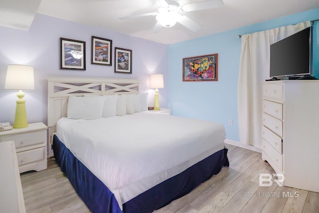 bedroom featuring light wood-style flooring and a ceiling fan