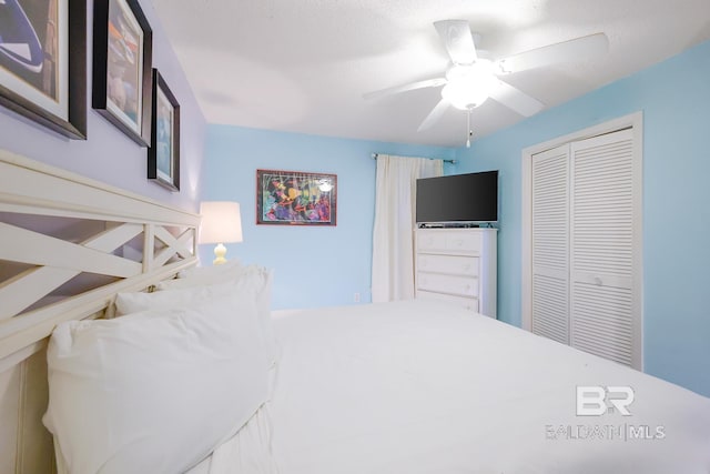 bedroom with a closet and a ceiling fan