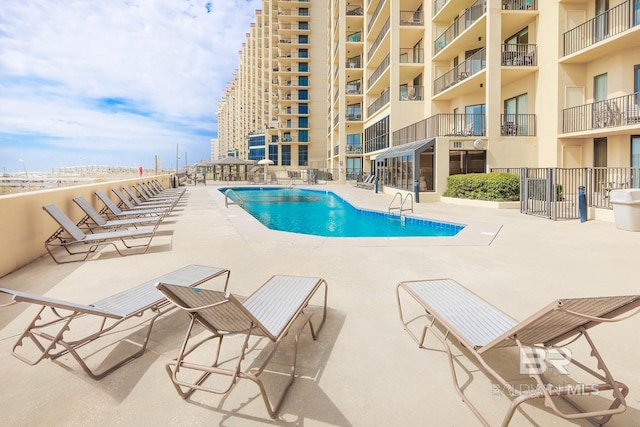 pool featuring a patio area