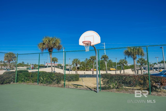 view of sport court featuring community basketball court and fence