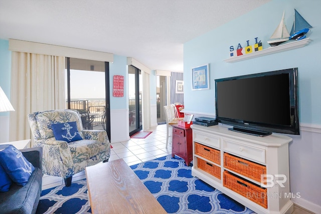 living room featuring tile patterned floors and a textured ceiling
