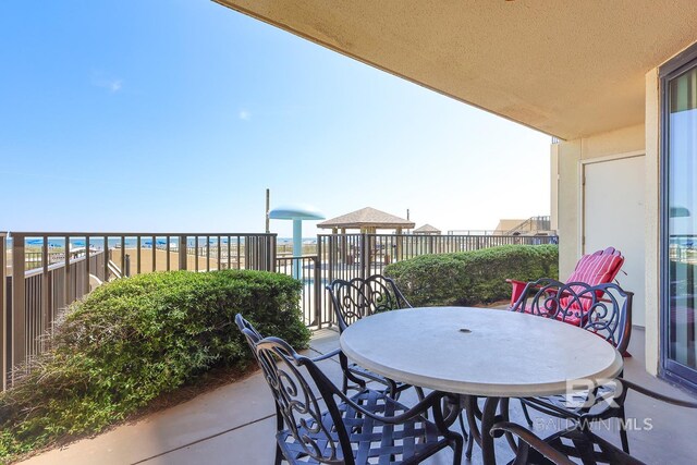 balcony featuring outdoor dining space