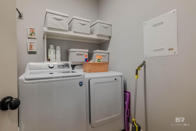 washroom featuring washer and clothes dryer