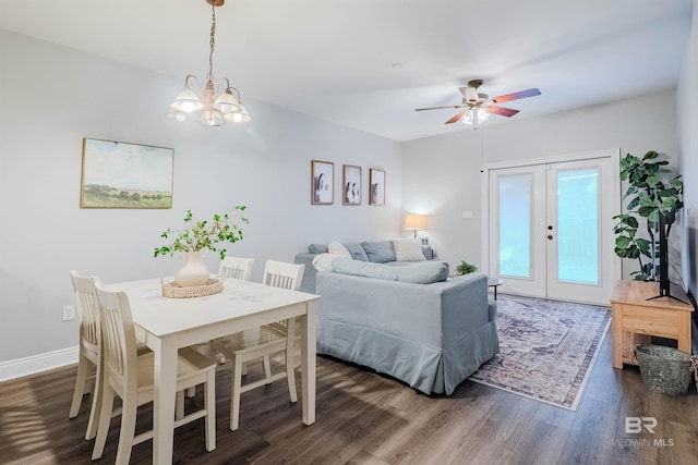 interior space with ceiling fan with notable chandelier, french doors, dark hardwood / wood-style flooring, and access to outside