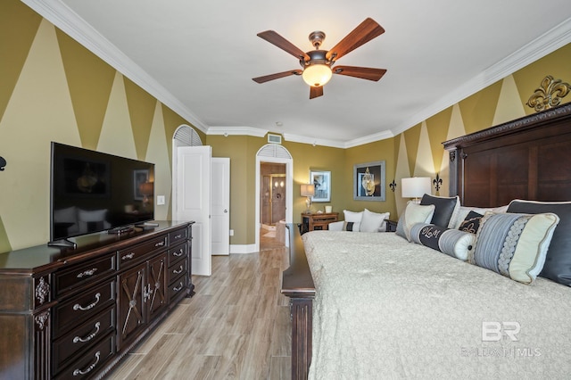28107 Perdido Beach Blvd Unit D914, Orange Beach, AL 36561 - bedroom featuring ornamental molding, baseboards, arched walkways, light wood finished floors, and ceiling fan