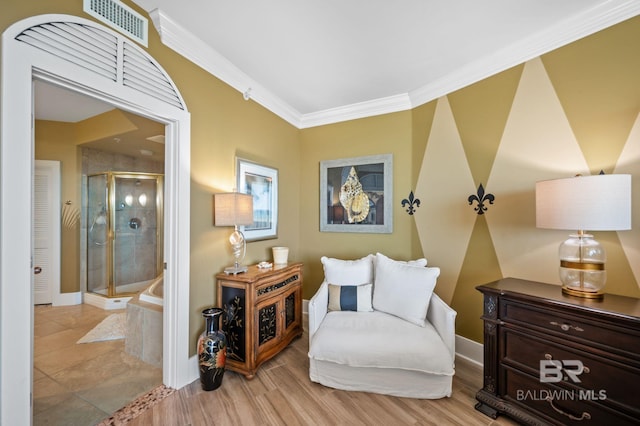 28107 Perdido Beach Blvd Unit D914, Orange Beach, AL 36561 - sitting room featuring baseboards, visible vents, crown molding, and wood finished floors