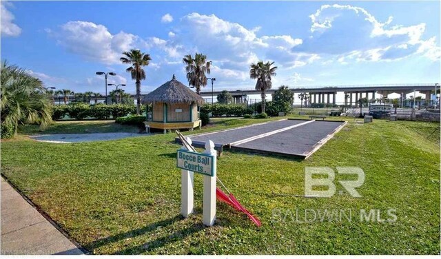 28107 Perdido Beach Blvd Unit D914, Orange Beach, AL 36561 - view of property's community featuring uncovered parking and a yard