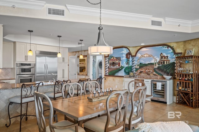 28107 Perdido Beach Blvd Unit D914, Orange Beach, AL 36561 - dining area featuring visible vents, wine cooler, ornamental molding, and light tile patterned floors